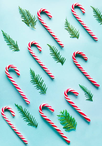 istock Christmas candy cane on blue background.  Flat lay. Top view. 619645862