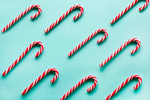 istock Christmas candy cane on blue background.  Flat lay. Top view. 619646002