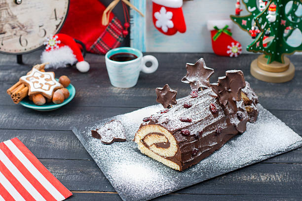 istock Cake Christmas log on New Year's table 619646040