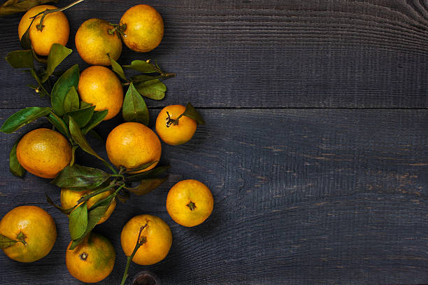 istock Yellow mandarins on the table 619646670