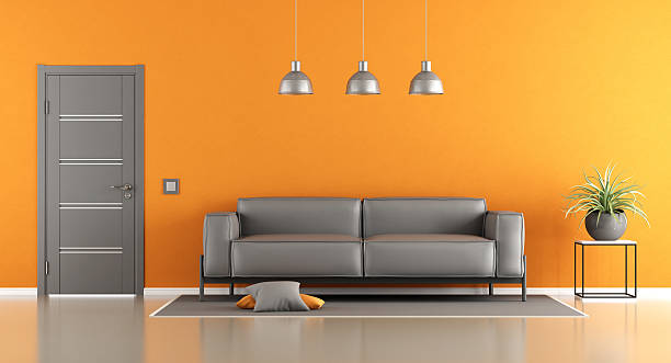 istock Gray and orange living room 619648242