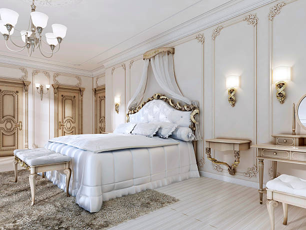 istock Luxurious bedroom in white colors in a classic style. 619648348