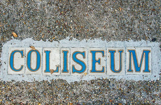 istock Coliseum text on ground in tile by asphalt 619648350