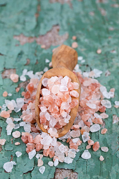istock pink salt on old wooden surface 619649834