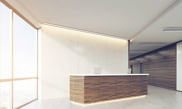 istock Side view of wooden sunlit reception counter 619650442