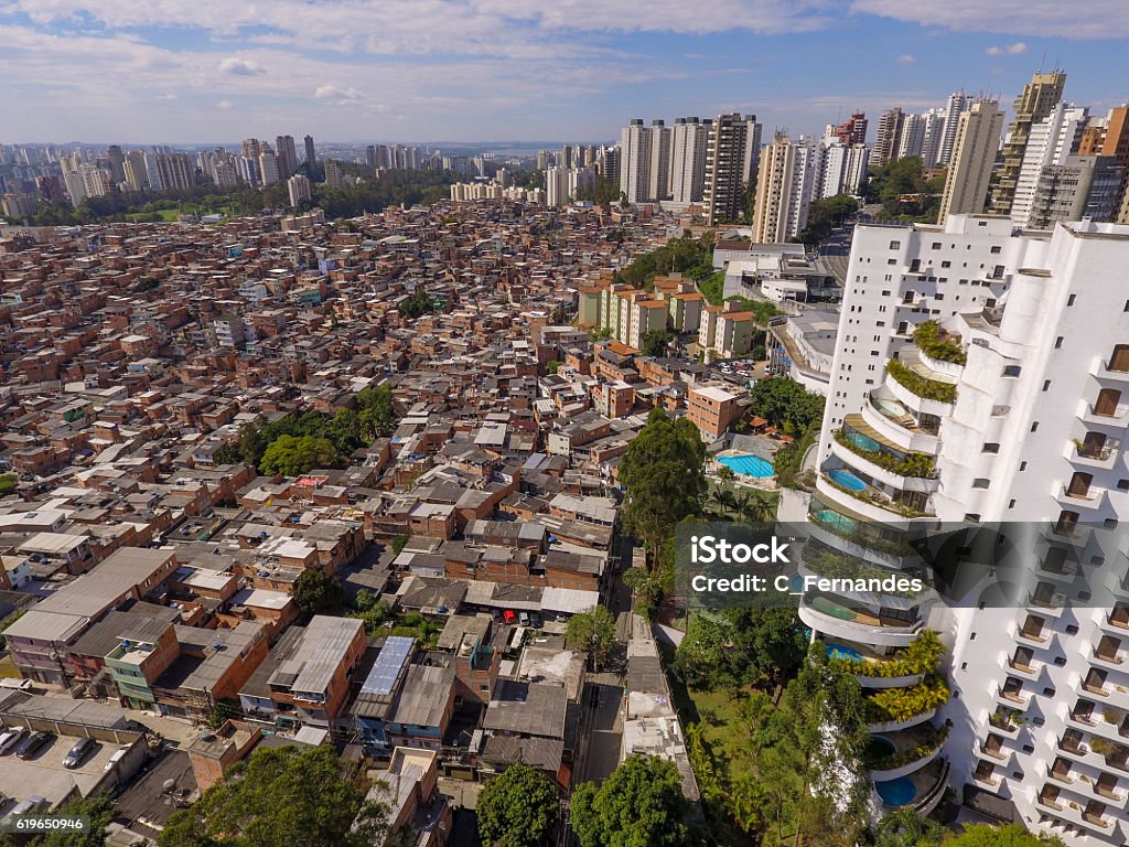 Favela do Paraisópolis The Paraisópolis Slum, the biggest one in São Paulo city, is next to Morumbi, a rich neighborhood, with high standard residencial buildings. Imbalance Stock Photo
