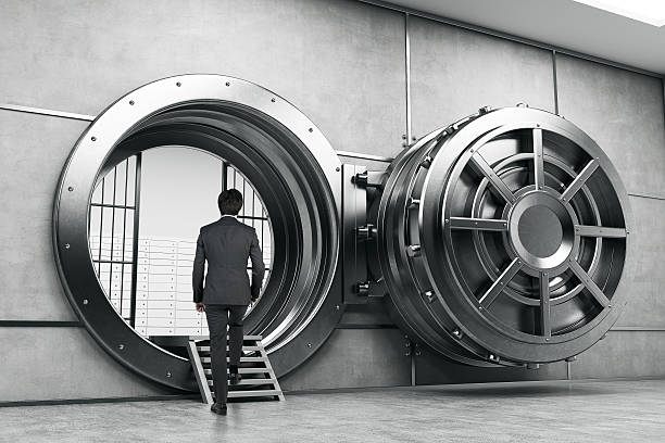 istock Man in suit entering the vault 619651298