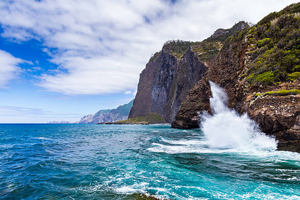 Ocean waves crashing against the rocks, north coast of Madeira island, Guindaste, Faial, Portugal.