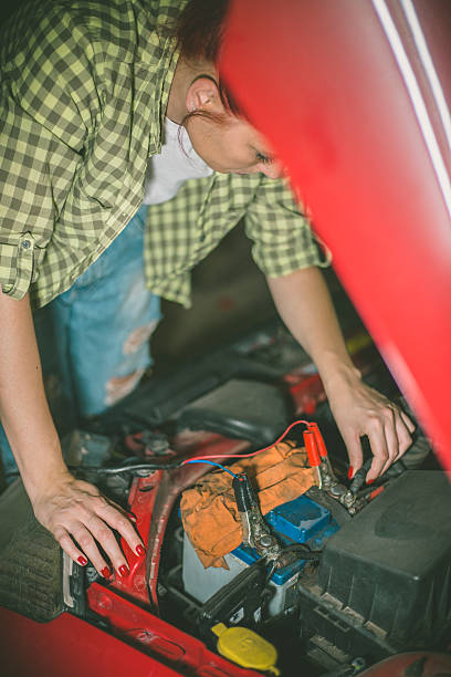 istock Mechanic repairing a car in a garage 619652468