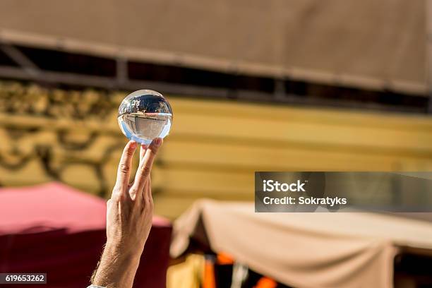 Hand Holding A Crystal Ball Stock Photo - Download Image Now - Astronomy, Crystal, Dark