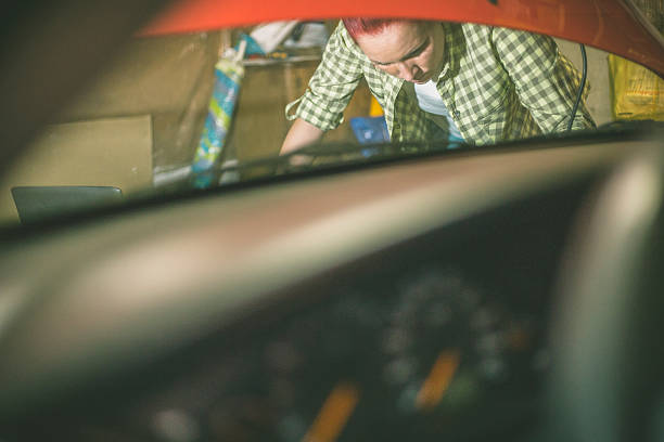 istock Mechanic repairing a car in a garage 619653336