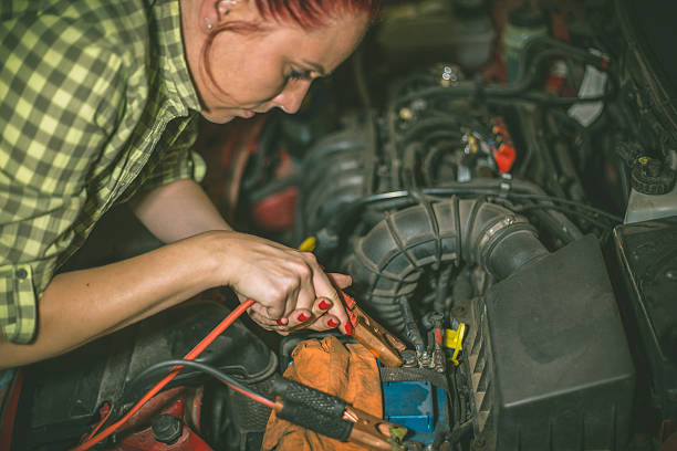 istock Mechanic repairing a car in a garage 619653624