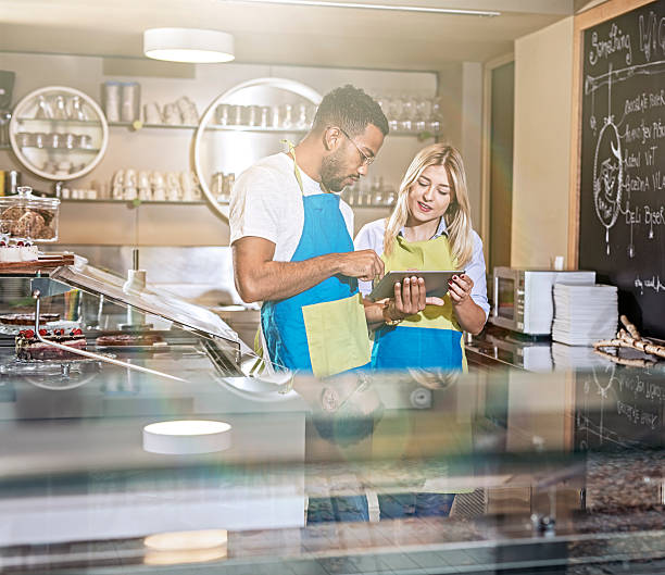 istock Coffee Shop Owner Using social media to their business advantage 619655330