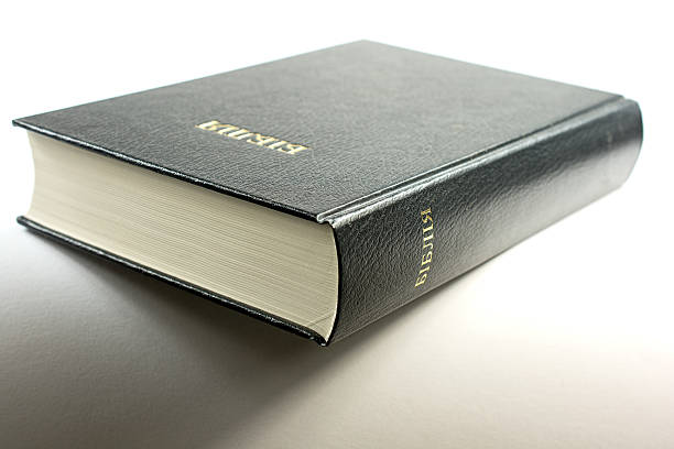 istock Black Ukrainian Bible on a white background with shadow 619655588