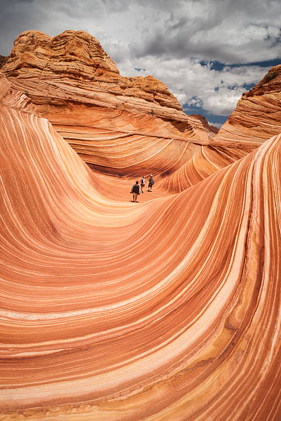 istock Three hikers at the Wave in Arizona 619656168