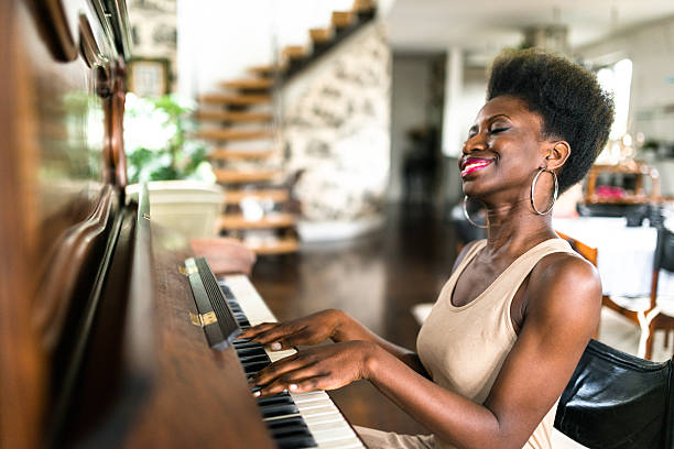 istock woman playing the piano 619657596