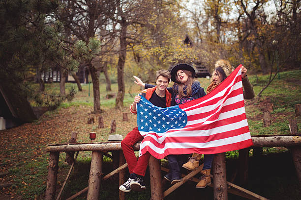istock Friends with an American flag 619657870