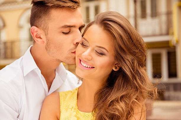 istock handsome young man kissing his beloved 619658500