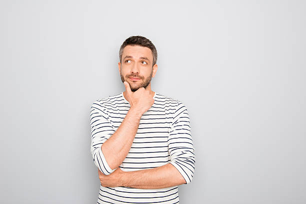 istock Successful thoughtful young businessman thinking about smth 619659834