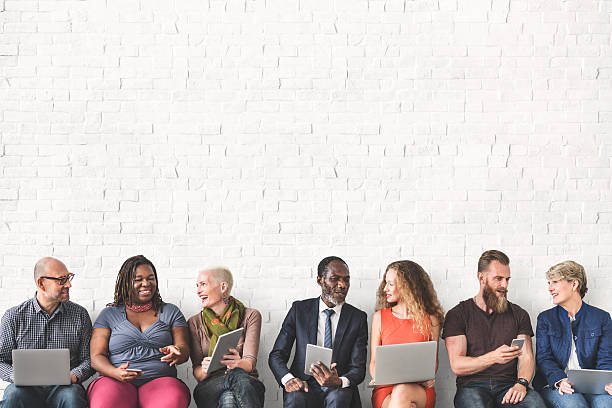 istock Diverse Group of People Community Togetherness Technology Sittin 619659836
