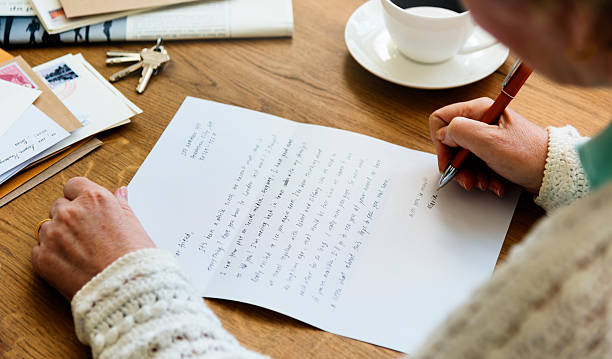 istock Senir Adult Reading Letter Postcard Concept 619660046