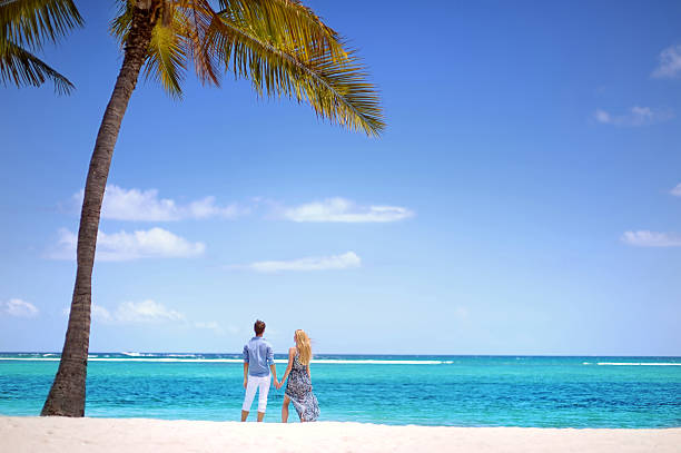 istock Young couple on a tropical island 619660688