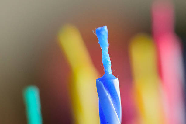 istock Macro background of colorful birthday cake candles 619661632