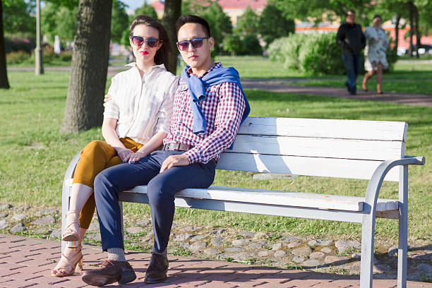 istock The loving couple is sitting on the bench. 619665248