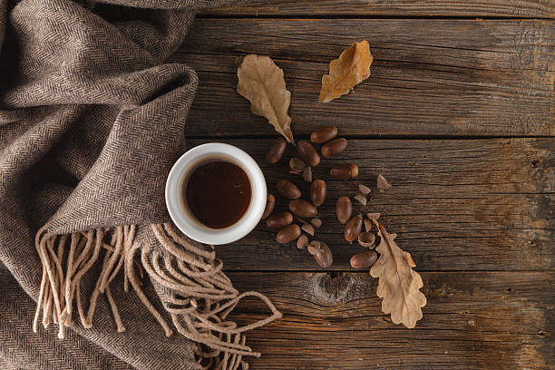 istock autumnal warm brown scarf and dry yellow leaf 619665546