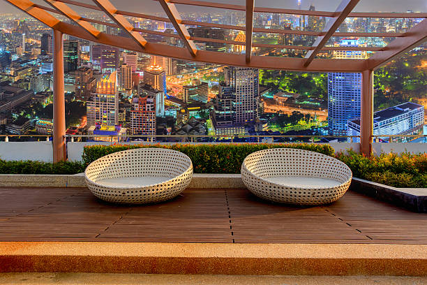 istock Relax corner on condominium rooftop garden with chairs 619665800