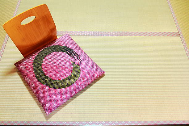 Wooden legless chair with Zabuton cushion on Tatami mat Japanese traditional wooden legless chair with Zabuton cushion on Tatami mat zabuton stock pictures, royalty-free photos & images
