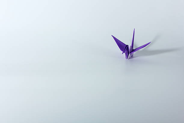 istock Paper crane isolated in white background 619666504