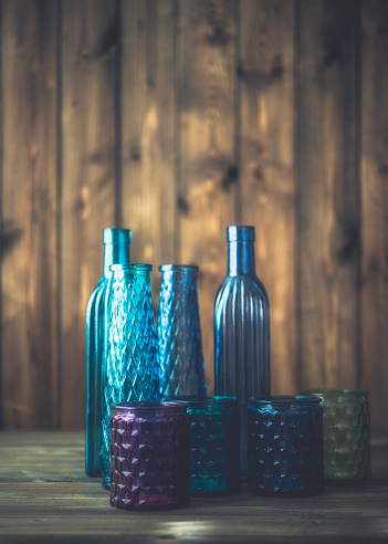 Collection of vibrant colored glass bottles and jars