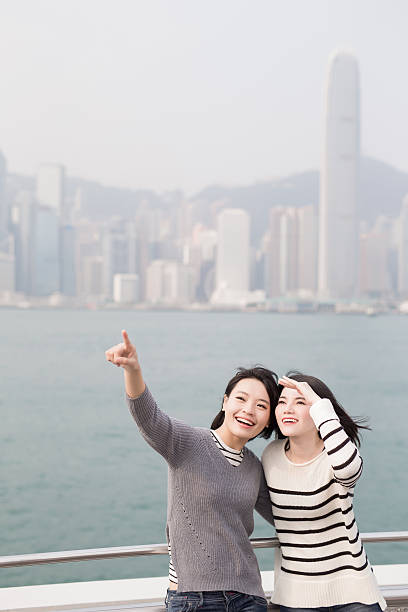 istock two beauty woman look somewhere 619668172