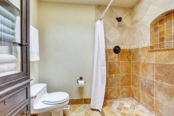 istock Bright clean interior of bathroom with brown tile 619668572