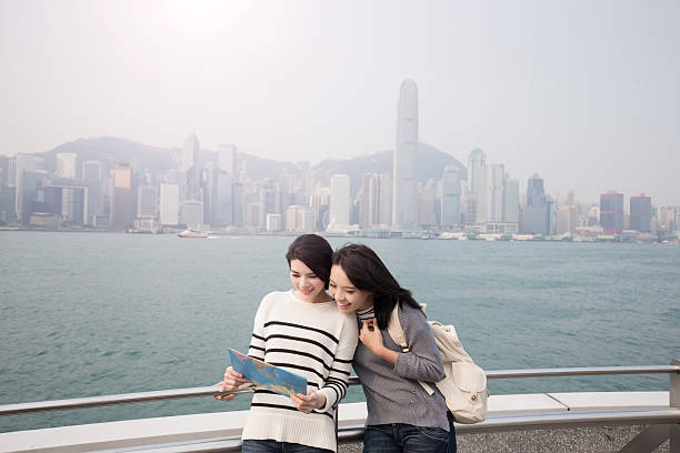 istock two beauty woman look map i 619668646