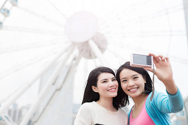istock two woman selfie in hongkong 619668944