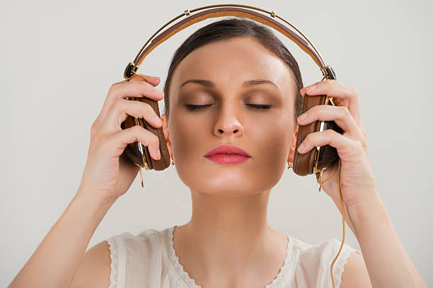istock Woman wearing headphones 619669168