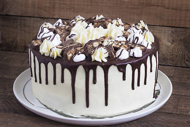 istock Round homemade cake with a meringue and chocolate 619669244