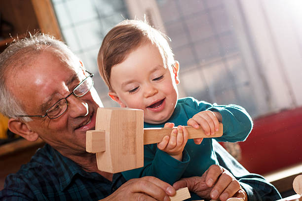istock Grandfather and grandson in workshop 619670838