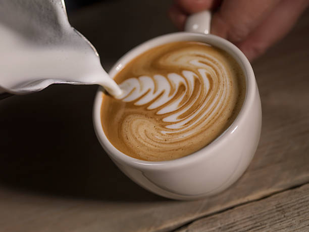 istock Cappucino in coffe cup with a can 619671566
