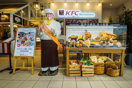 Osaka, Japan - October 25, 2016: A food display and signage outside a KFC restaurant at Lalaport Expocity.