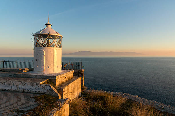 istock Amazing Sunset over Lighthouse in Kavala, Greece 619672326