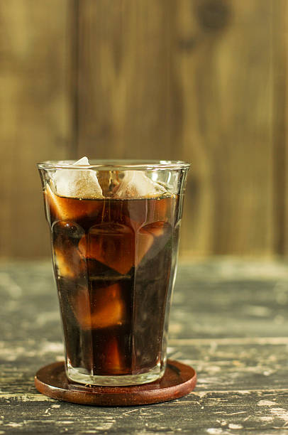 istock Iced coffee black coffee on wood table 619675104