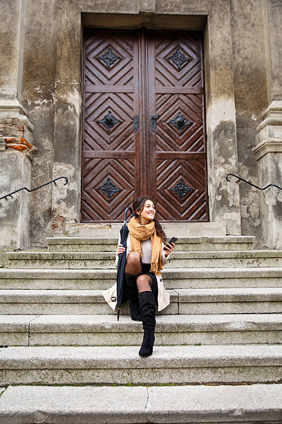 istock Woman with umbrella 619675506