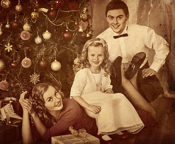 istock Family with children pose under Christmas tree. 619675530