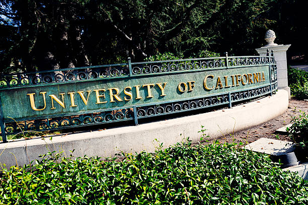 Sign, University of California at Berkeley Berkeley, California, USA - October 15, 2016:  University of California entrance sign on the corner of Oxford Street and Center Street at Berkeley, California. Over 150 years old, and with many Nobel Prizes winners (they even have reserved parking spots for them), the campus serves almost 40,000 students within an open green space. berkeley california stock pictures, royalty-free photos & images