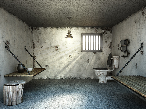 Inside of an old and dirty prison cell with wooden beds and a small barred window. Generic 3D design.
