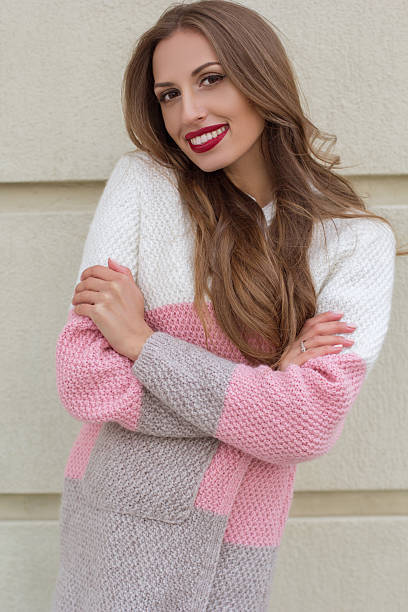 istock Pretty woman is wearing cozy knitted sweater 619732944