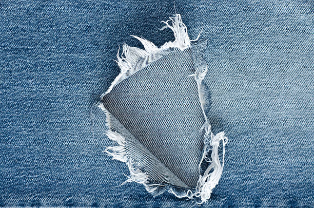 istock .Denim jeans texture or denim jeans background with old torn. 619733814